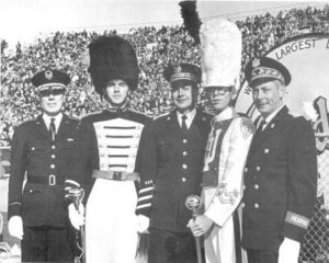 J. Robert Schlatter (center), with two former students and the IU and Purdue Band Directors